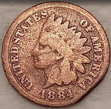1884 Indian Head penny clipped planchet error showing a curved bite taken from the planchet rim, full date still visible